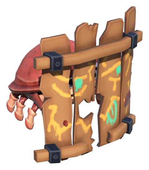 The shield crab, crouched behind wooden planks painted with an angry face.