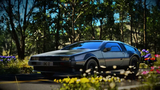 A brushed steel DeLorean DMC-12 on a sunlit woodland road with wildflowers in front of it.